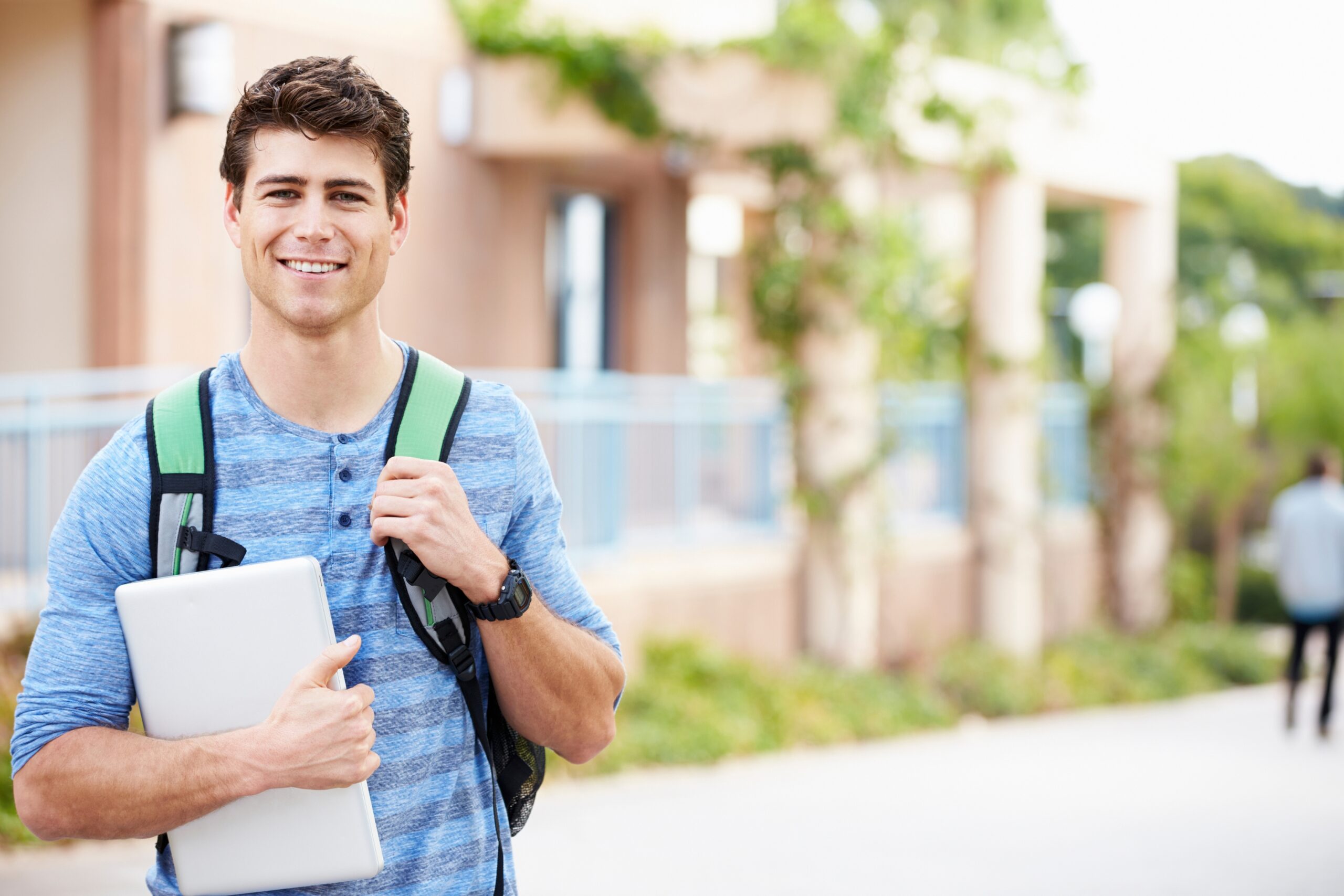 Student smiling after dental appointment in Guildford